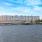 large body of water with a building in the background
