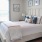 a bed with a white comforter