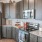 a kitchen with dark wood cabinets